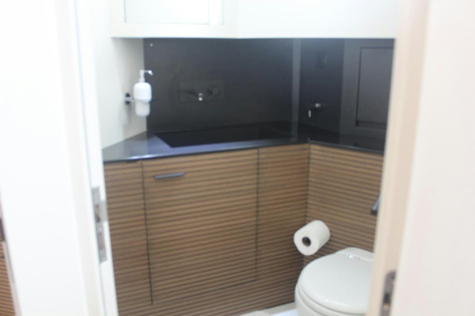 a bathroom with a black counter aboard FELINA Yacht for Sale