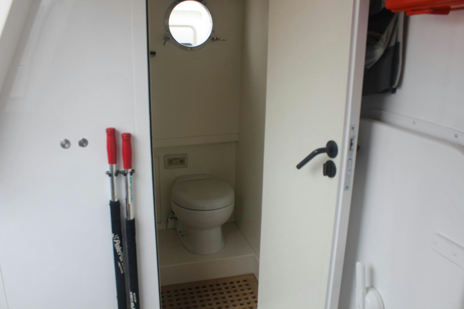 a toilet in a bathroom aboard FELINA Yacht for Sale