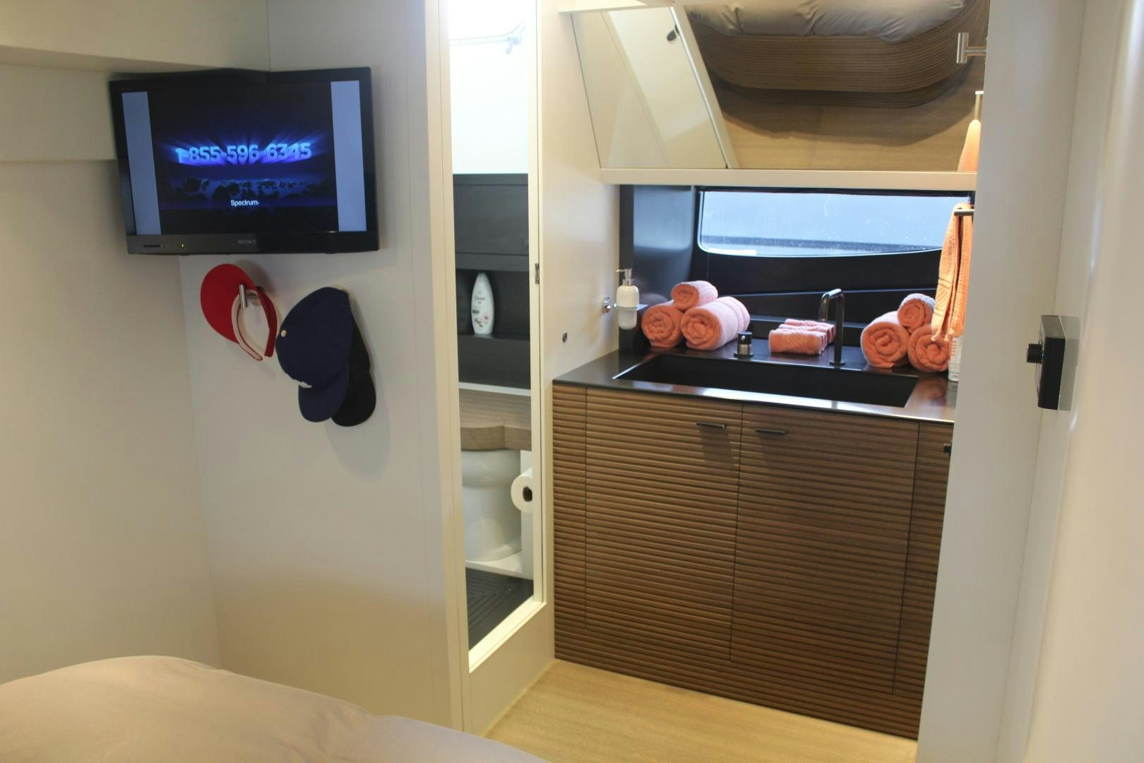 a tv on a wall aboard FELINA Yacht for Sale