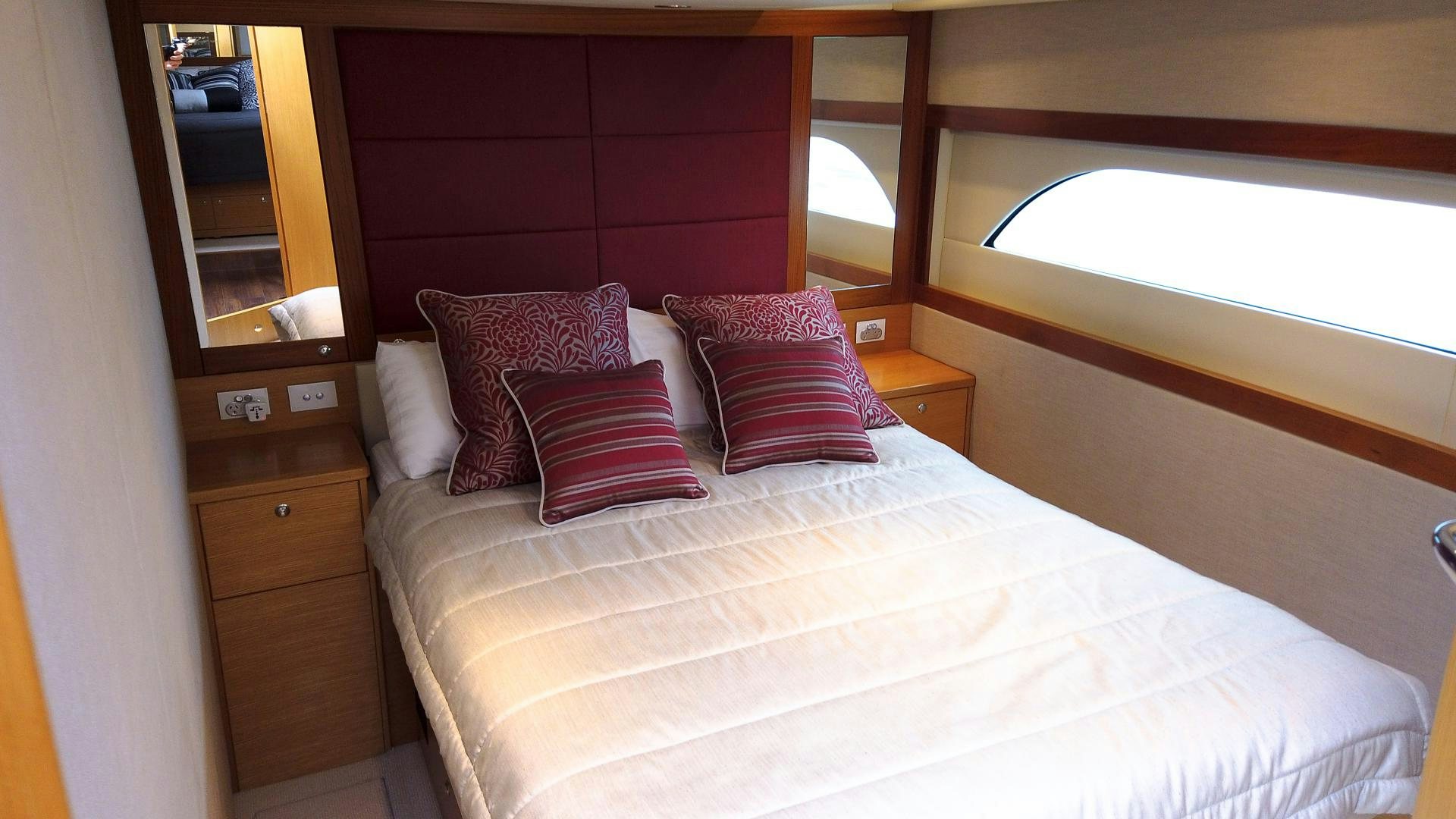 a bed with pillows and pillows aboard SURVIVOR Yacht for Sale