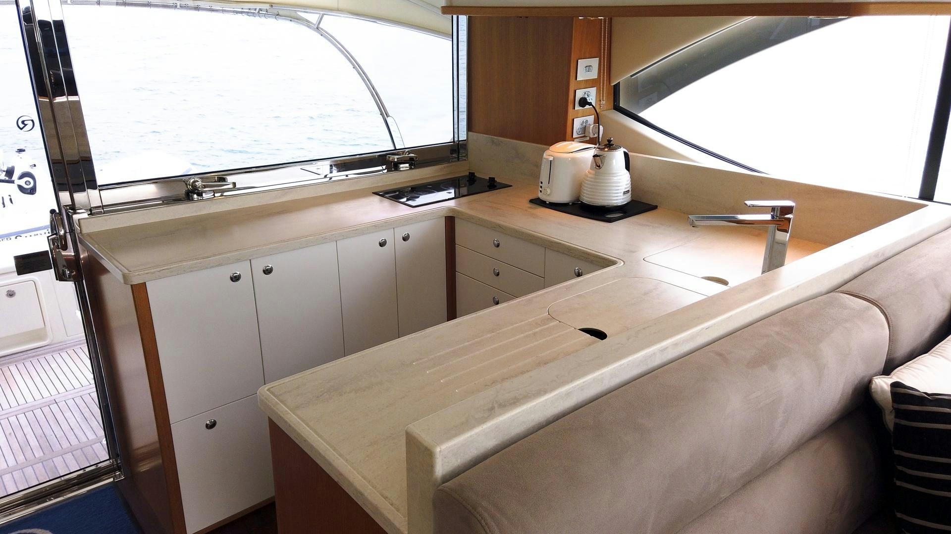 a kitchen with a white counter aboard SURVIVOR Yacht for Sale