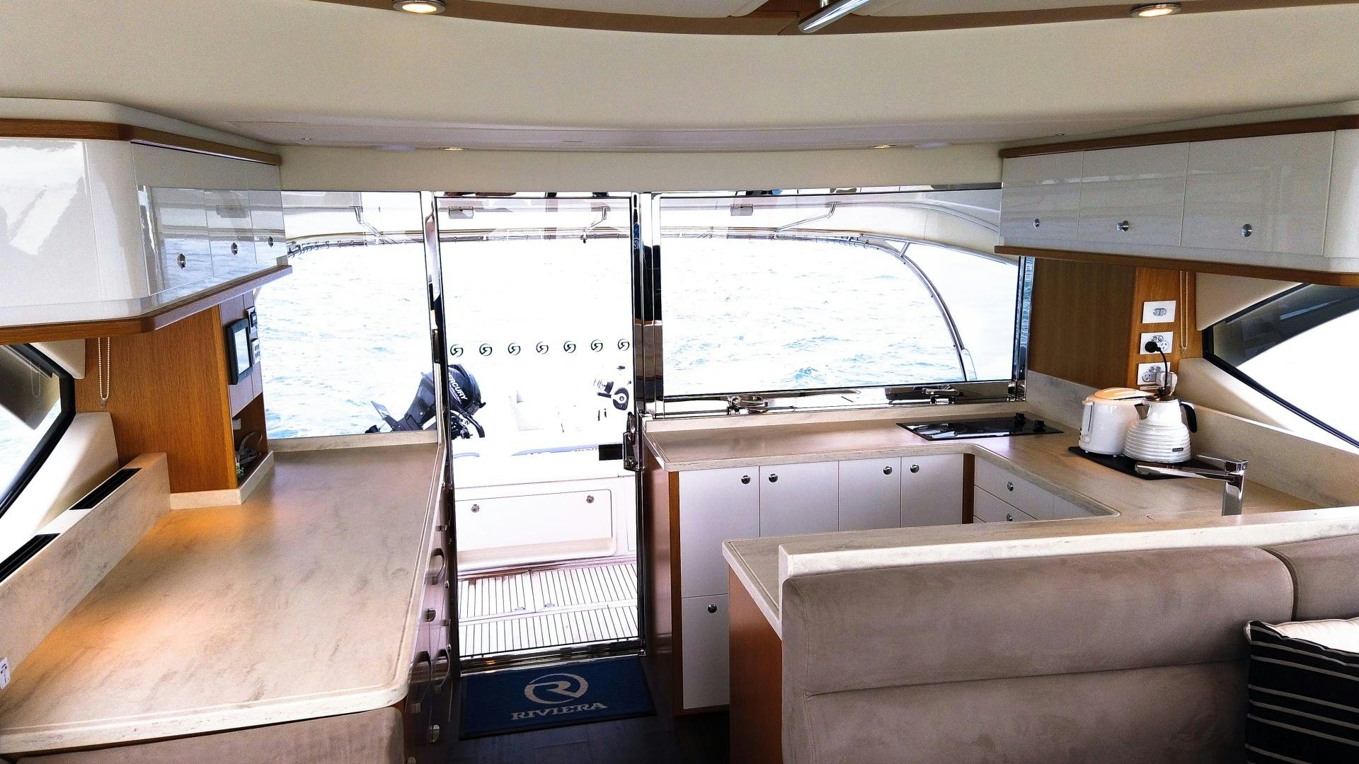 a kitchen with a large window aboard SURVIVOR Yacht for Sale
