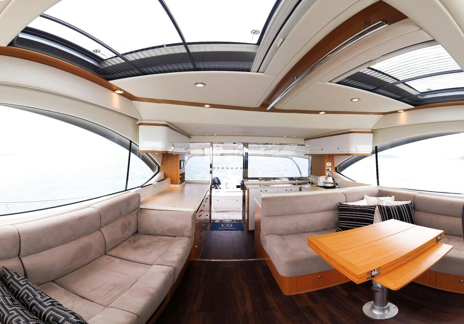 a room with a couch and a table aboard SURVIVOR Yacht for Sale