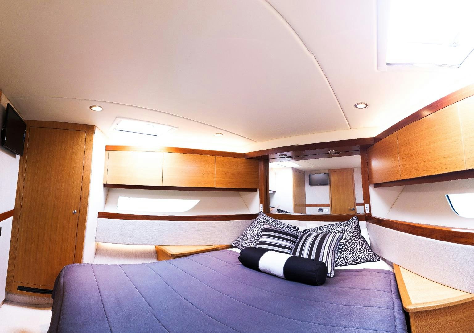 a bed in a room aboard SURVIVOR Yacht for Sale