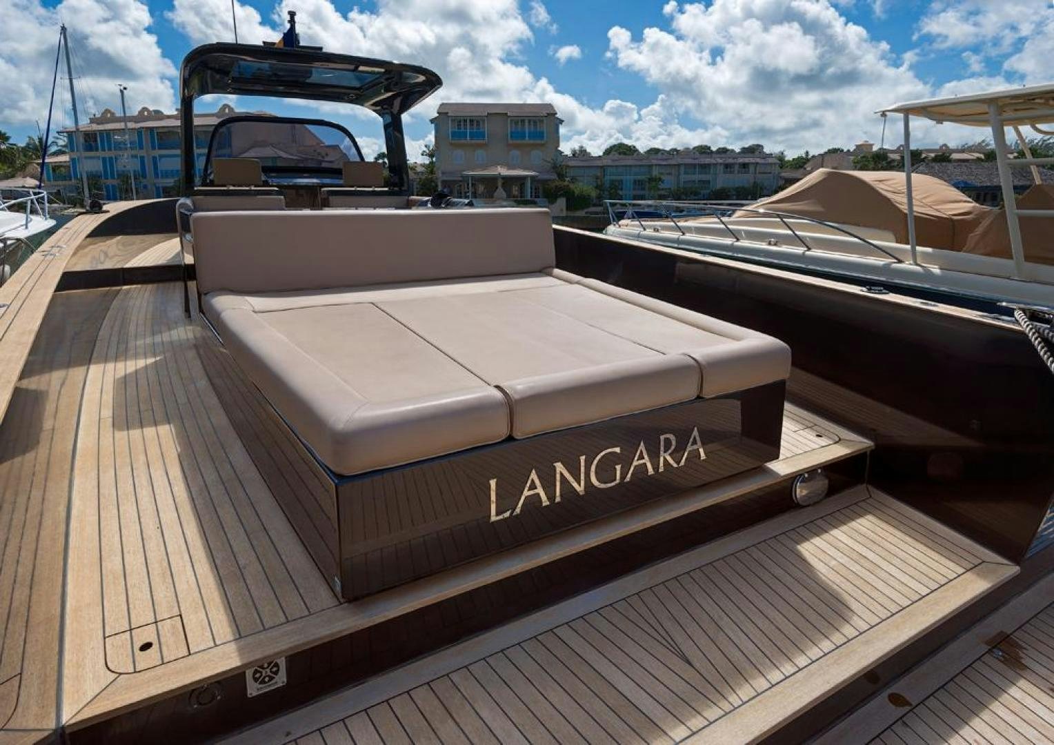 a large white boat on a dock aboard LANGARA Yacht for Sale