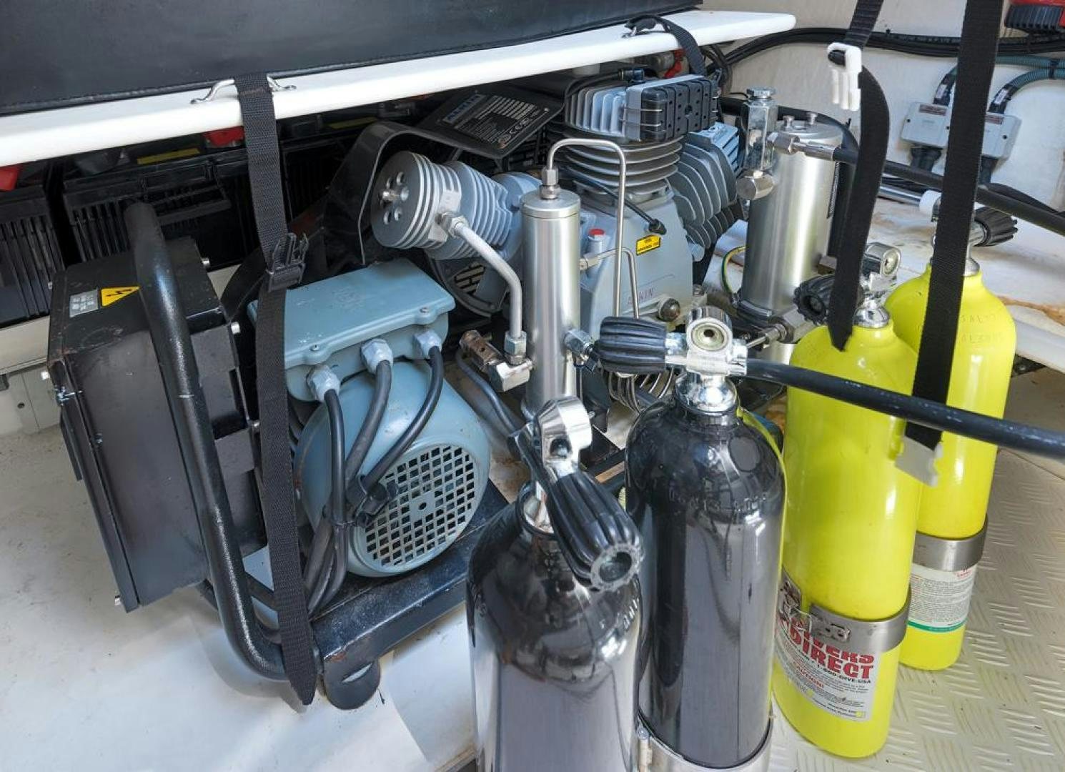 a car engine with a yellow and blue engine aboard LANGARA Yacht for Sale