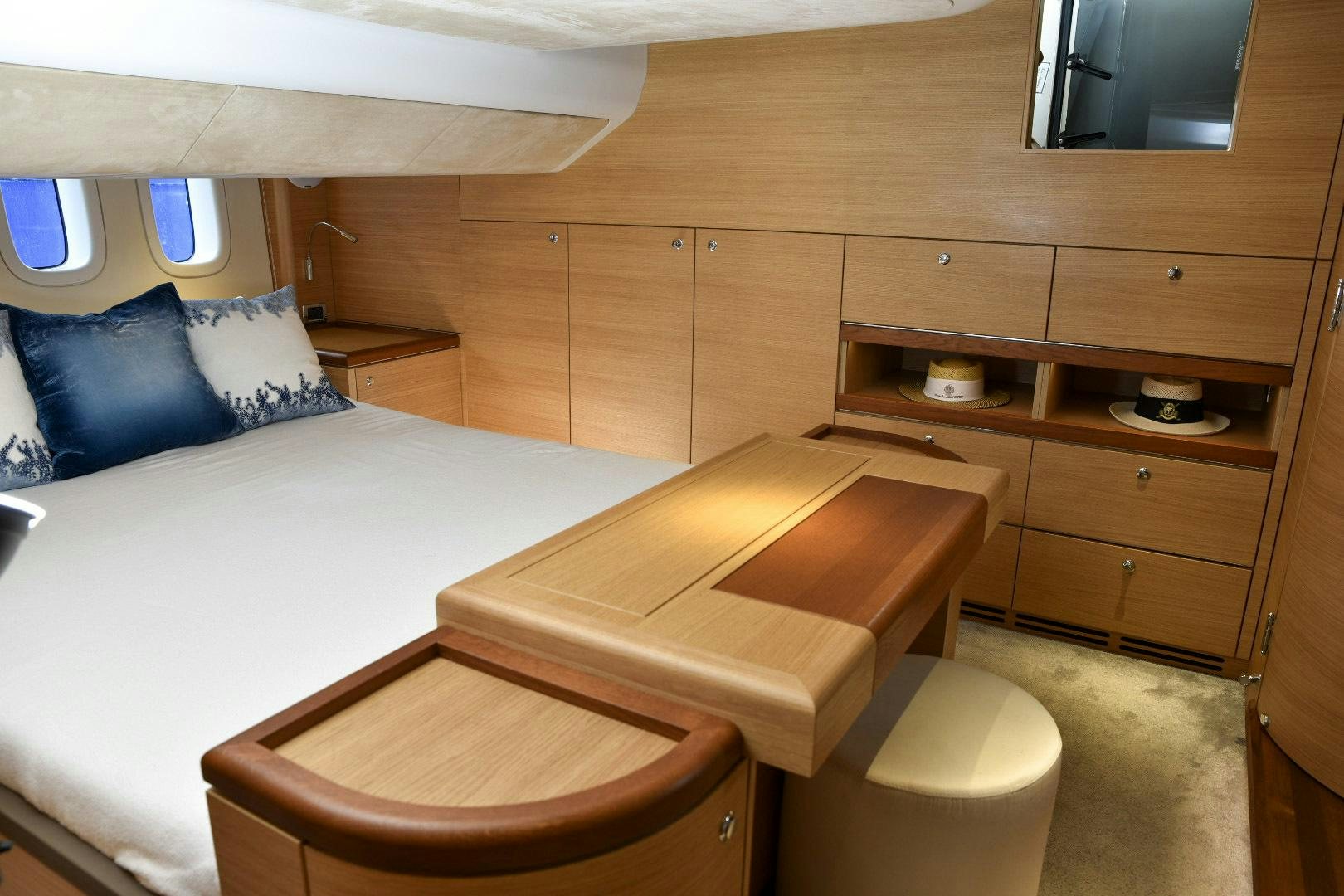 a room with a bed and a desk aboard ALMOST HEAVEN Yacht for Sale