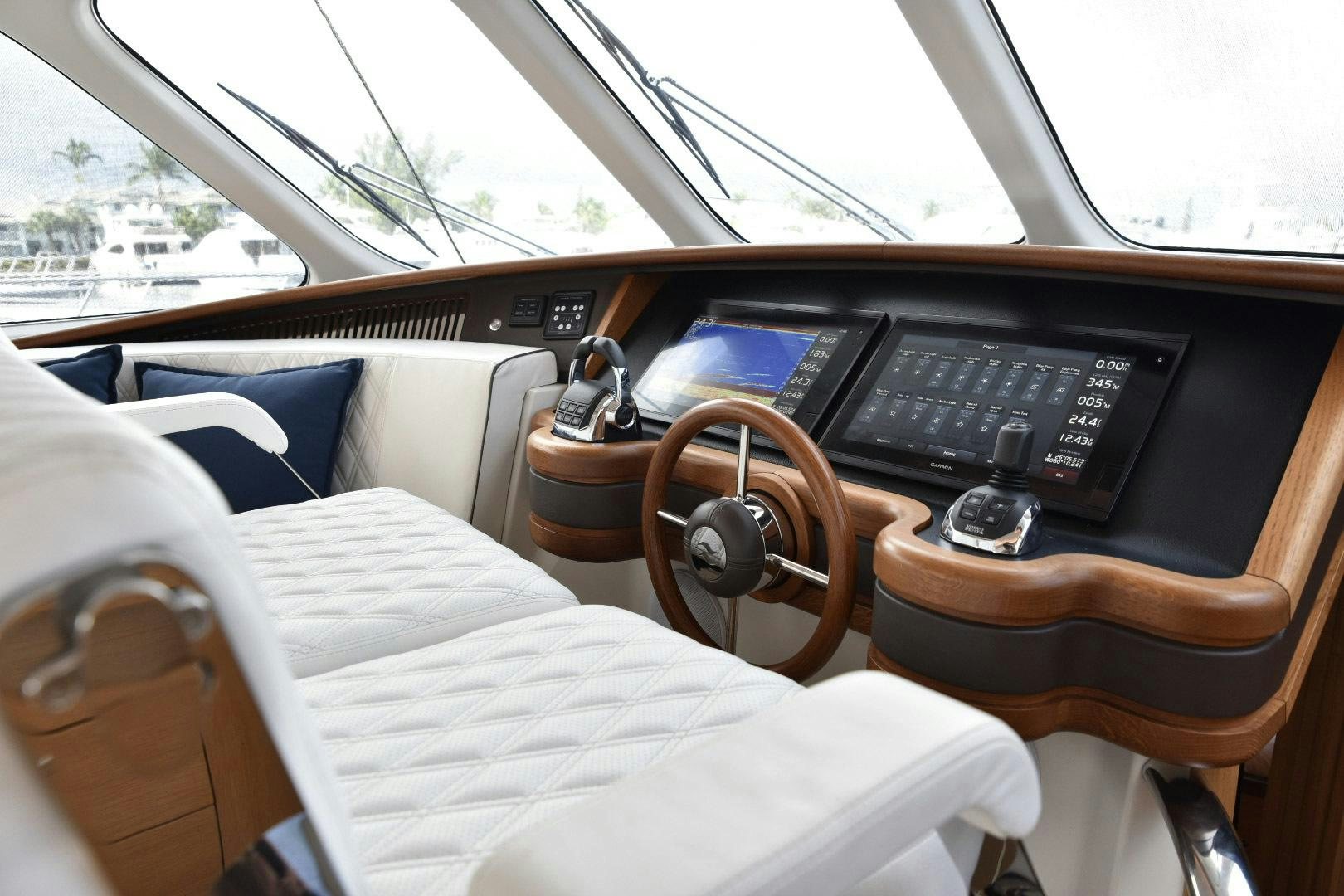 a car interior with a steering wheel and a seat belt aboard ALMOST HEAVEN Yacht for Sale
