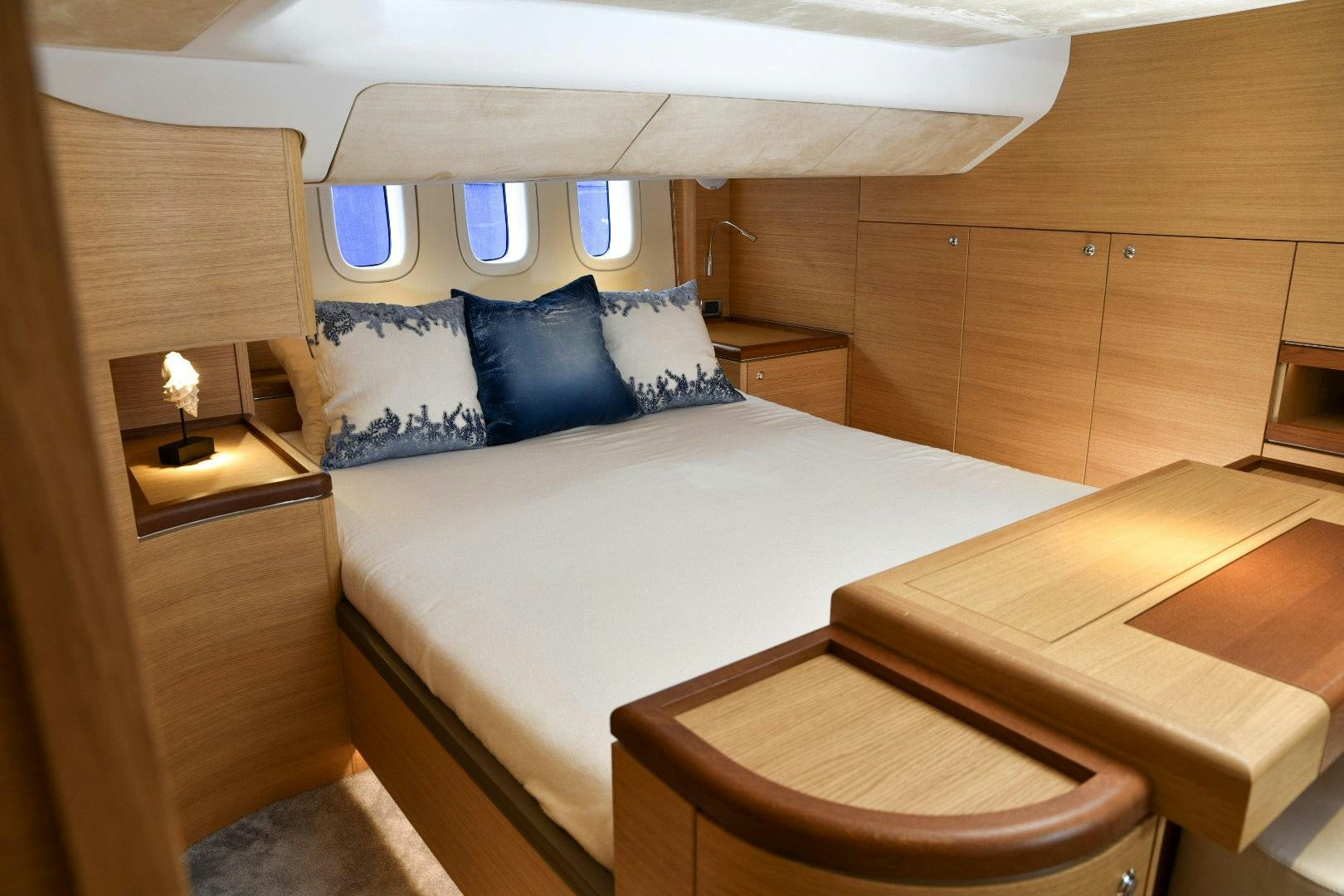 a room with a bed and a table aboard ALMOST HEAVEN Yacht for Sale