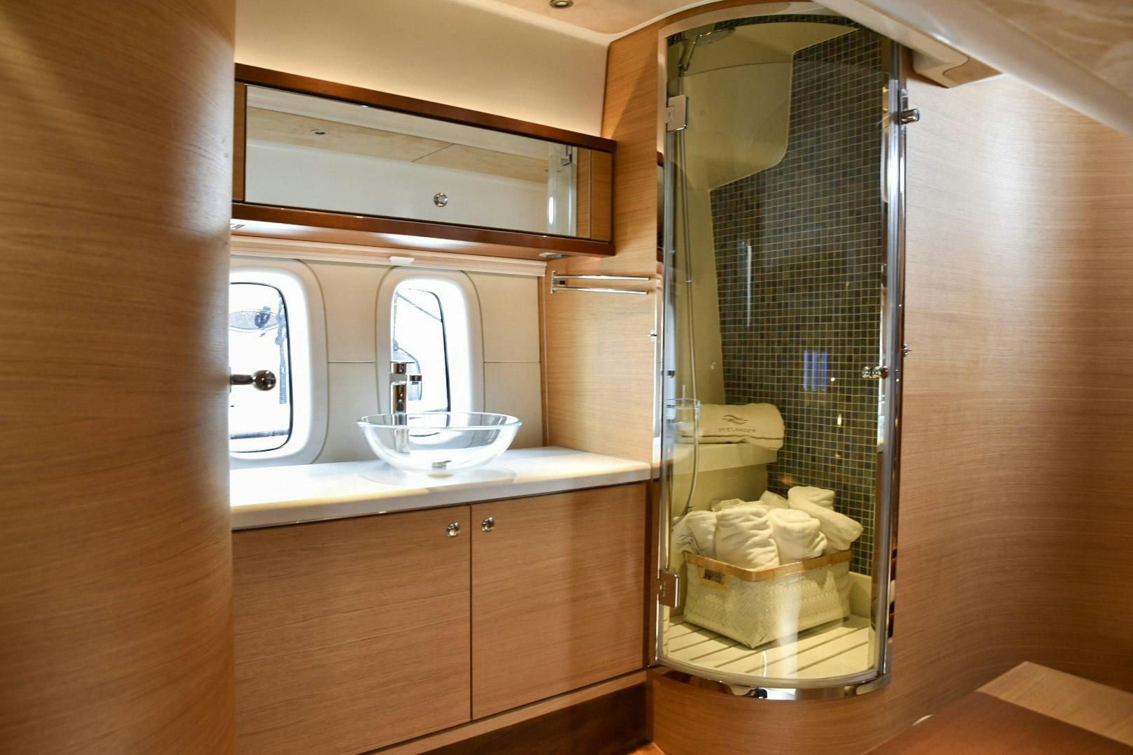 a bathroom with a large mirror aboard ALMOST HEAVEN Yacht for Sale