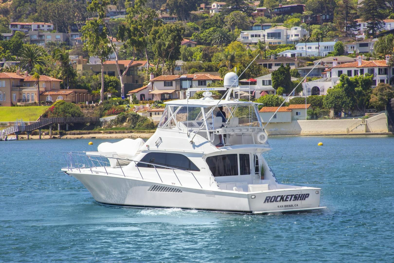 a white boat on the water aboard ROCKETSHIP Yacht for Sale