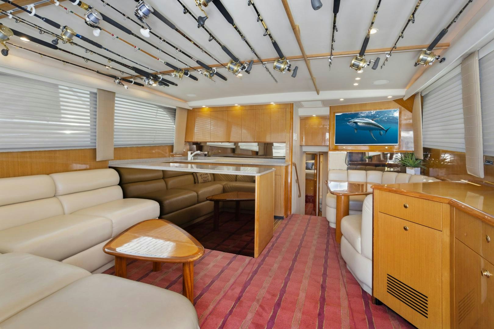 a living room with a red rug aboard ROCKETSHIP Yacht for Sale