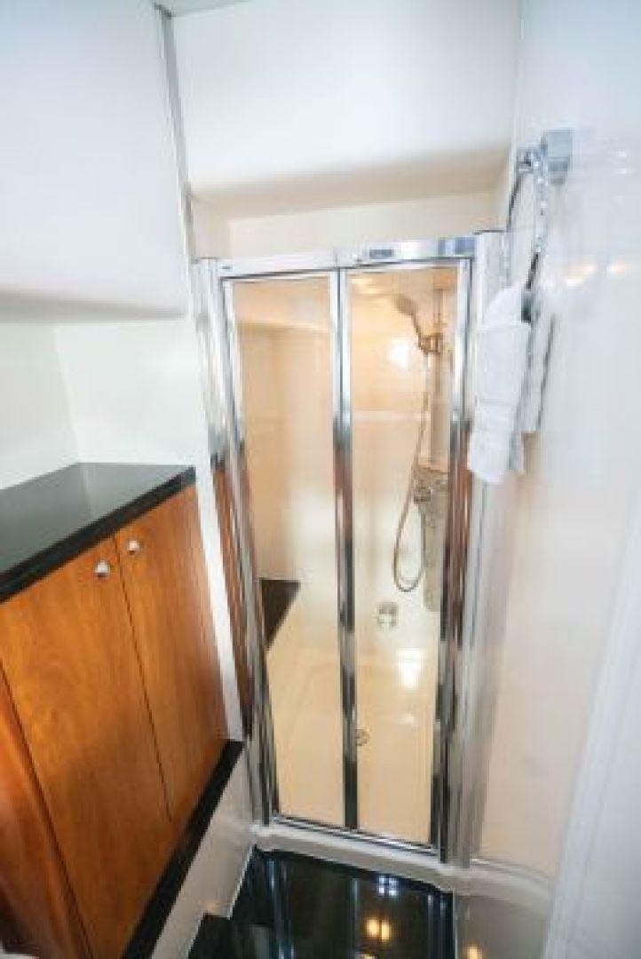 a shower unit with a glass door aboard SOLE MIO Yacht for Sale