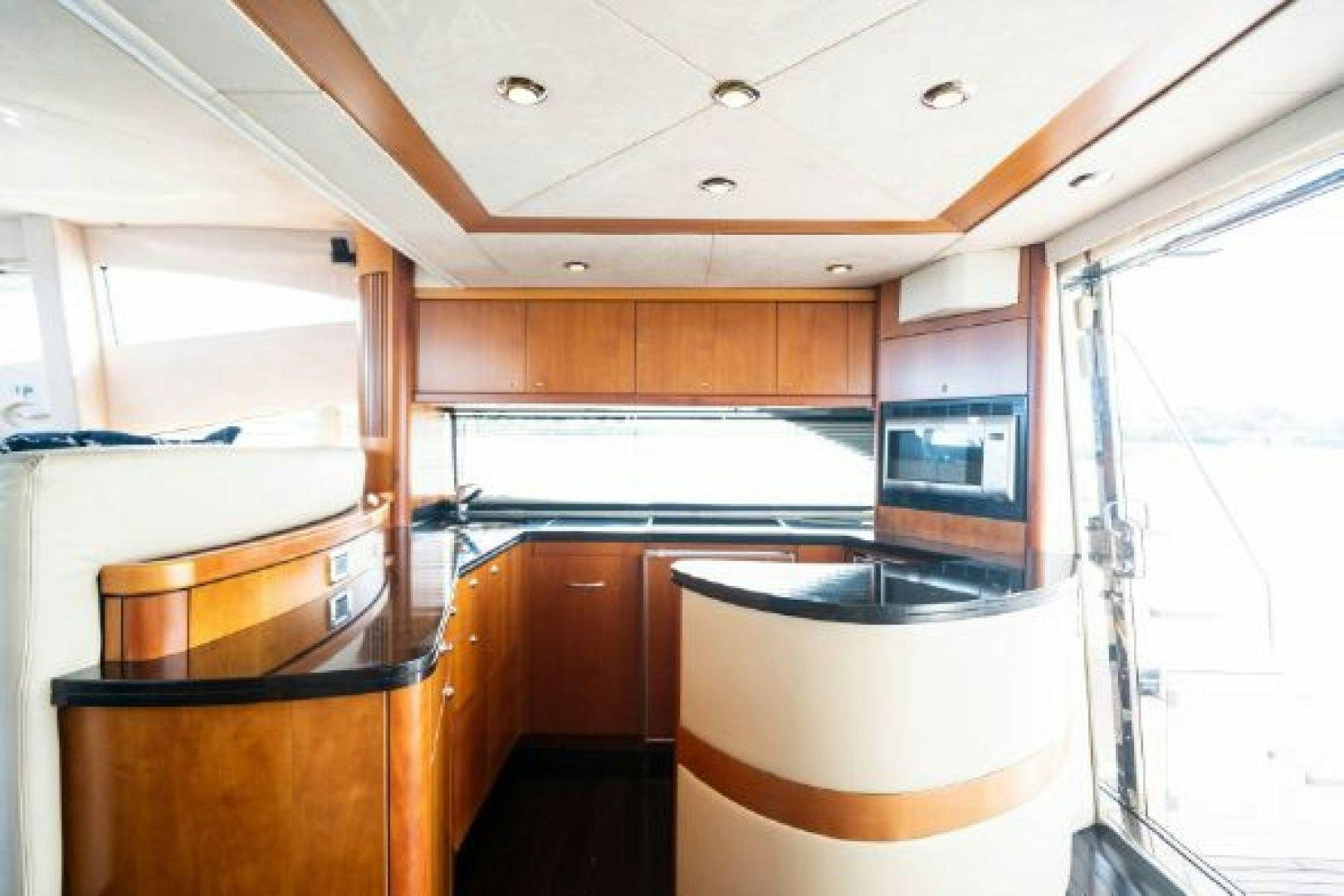 a kitchen with a large window aboard SOLE MIO Yacht for Sale