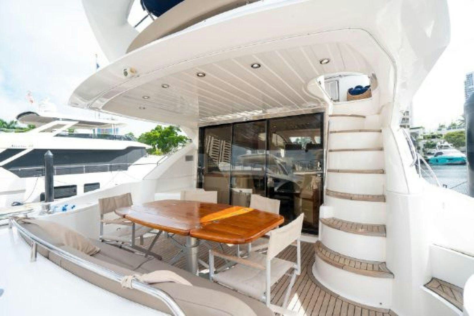 a boat with a table and chairs aboard SOLE MIO Yacht for Sale