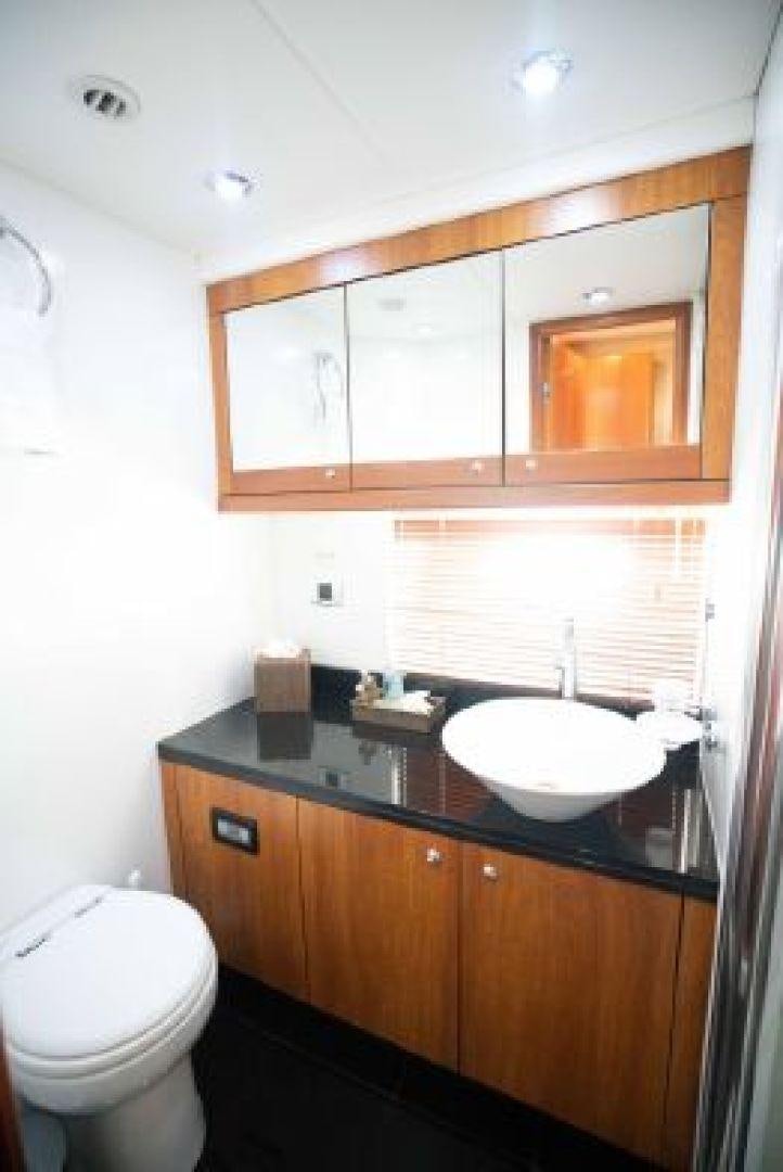 a bathroom with a sink and toilet aboard SOLE MIO Yacht for Sale