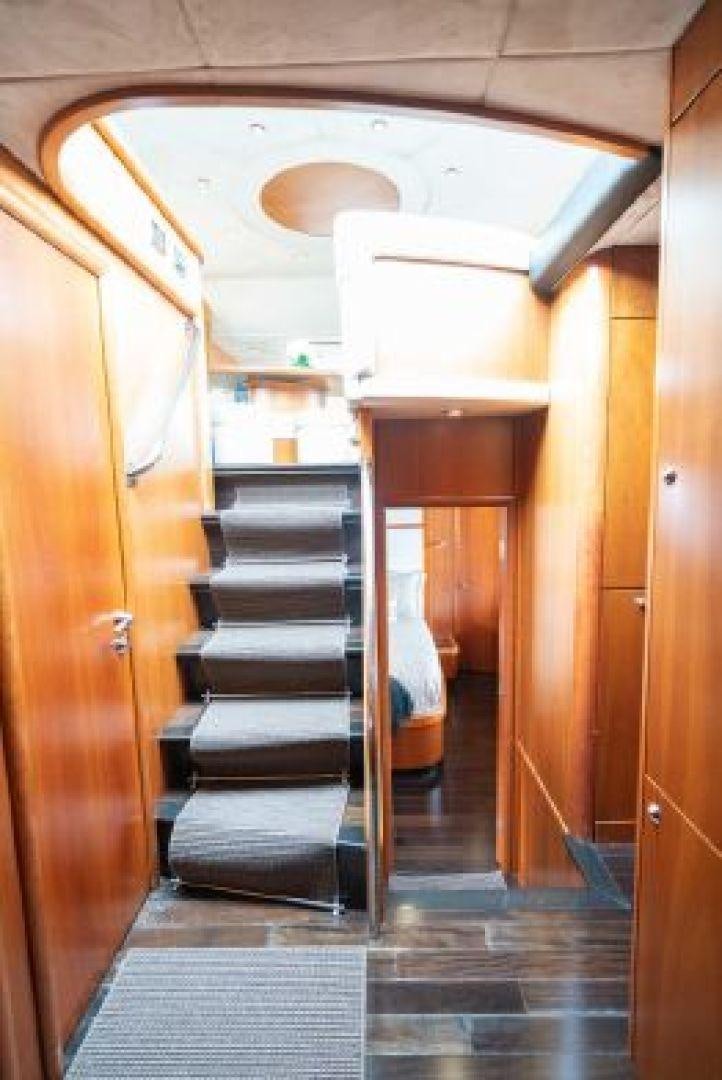 a hallway with a staircase aboard SOLE MIO Yacht for Sale