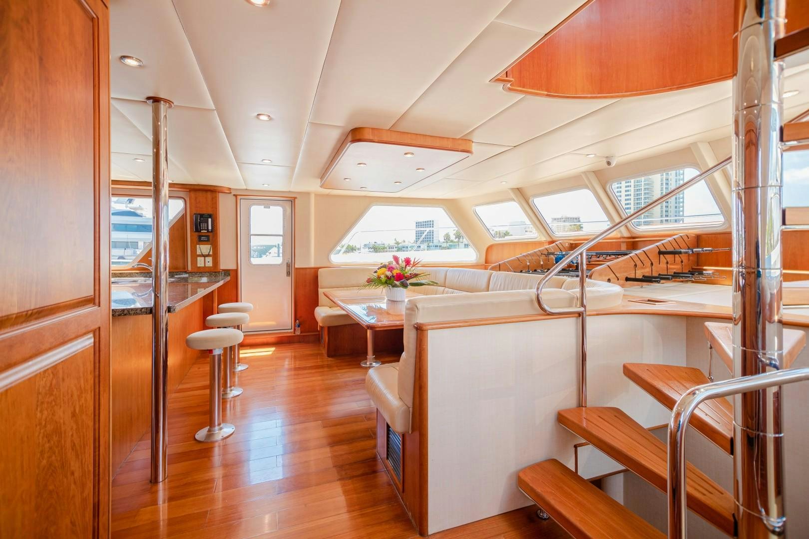 a room with a table and chairs aboard NO BOUNDARIES Yacht for Sale