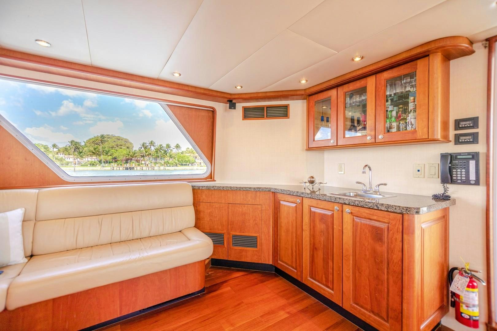 a living room with a couch and a television aboard NO BOUNDARIES Yacht for Sale