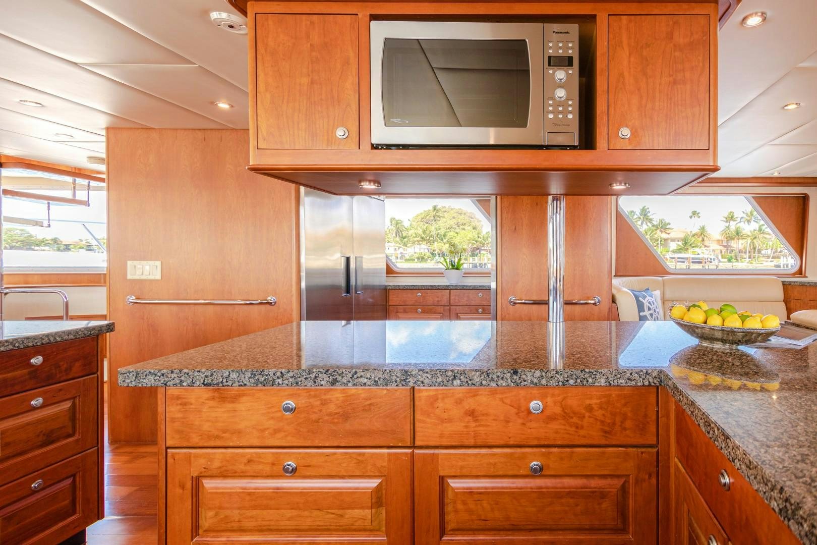 a kitchen with wooden cabinets aboard NO BOUNDARIES Yacht for Sale