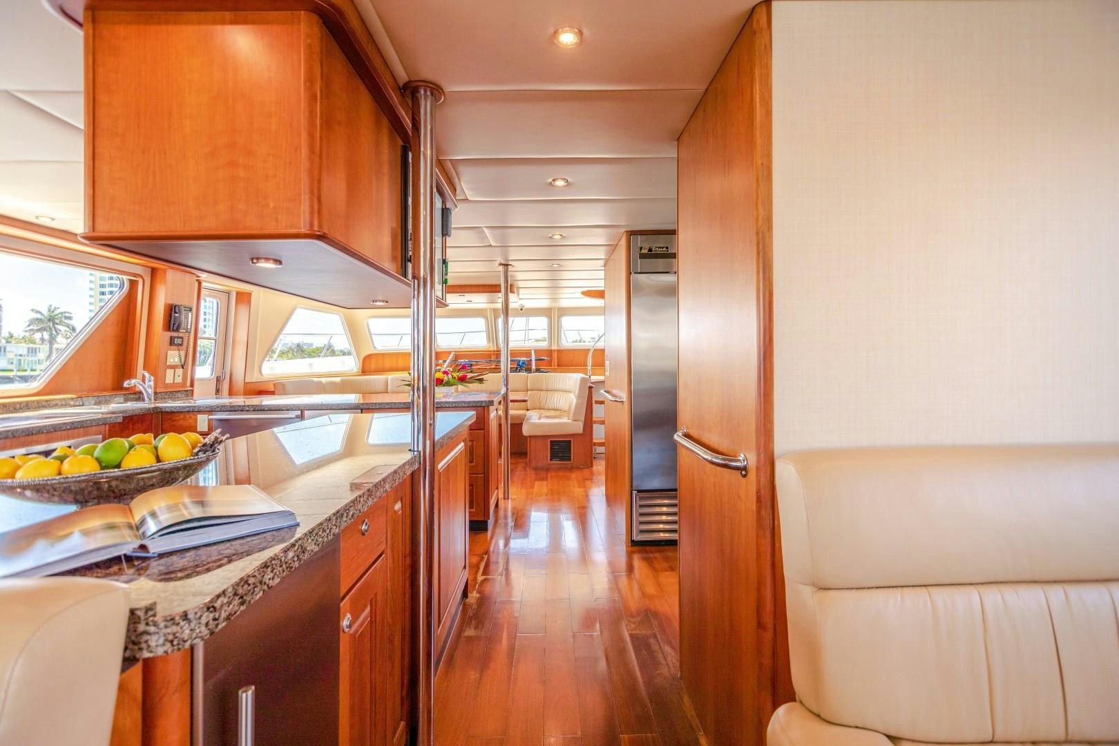 a kitchen with a large island aboard NO BOUNDARIES Yacht for Sale
