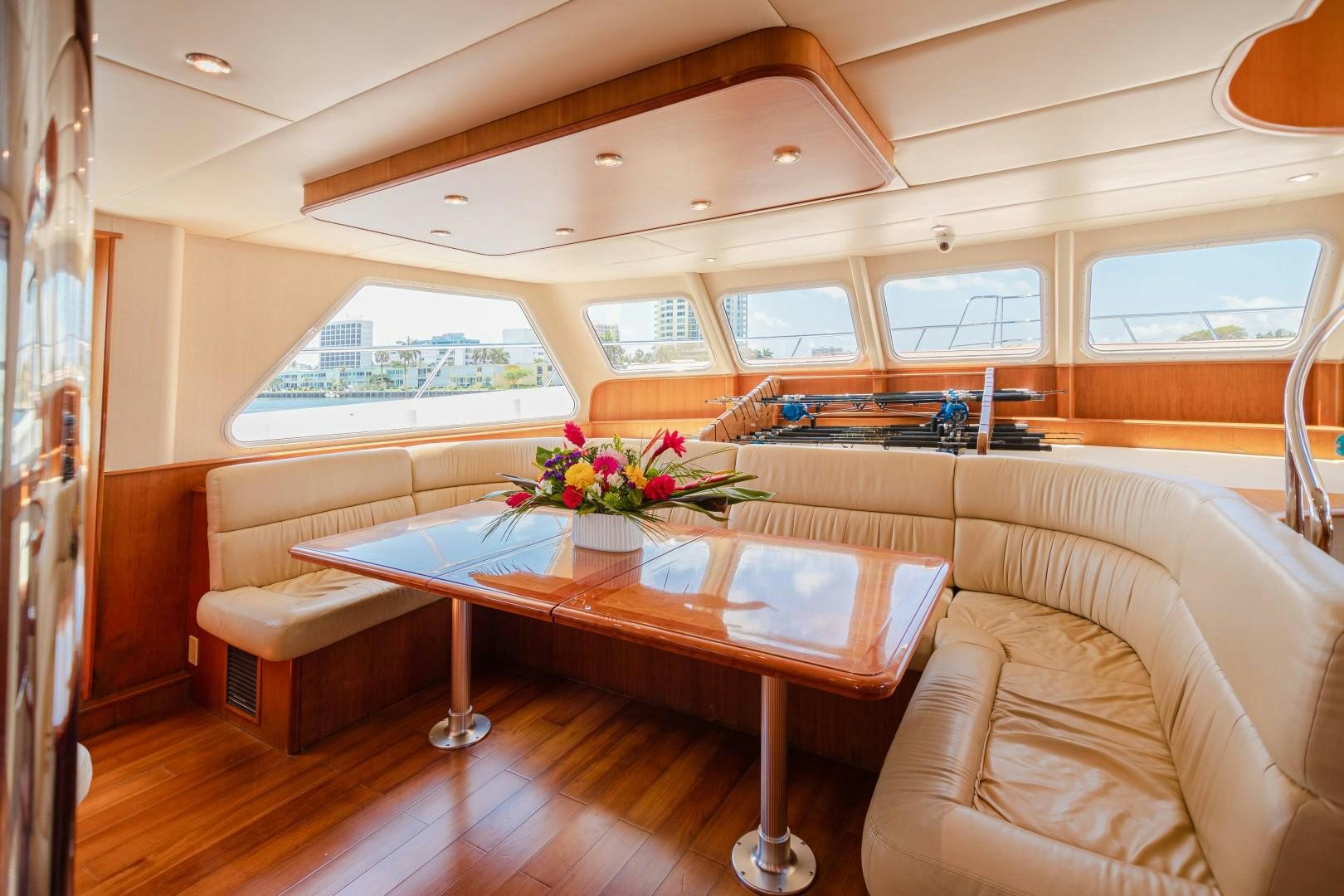 a living room with a table and couches aboard NO BOUNDARIES Yacht for Sale