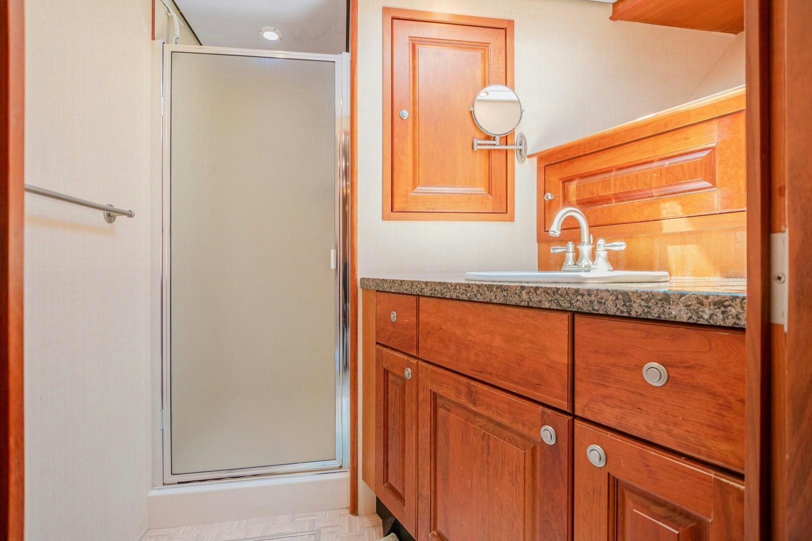 a bathroom with a sink and cabinets aboard NO BOUNDARIES Yacht for Sale