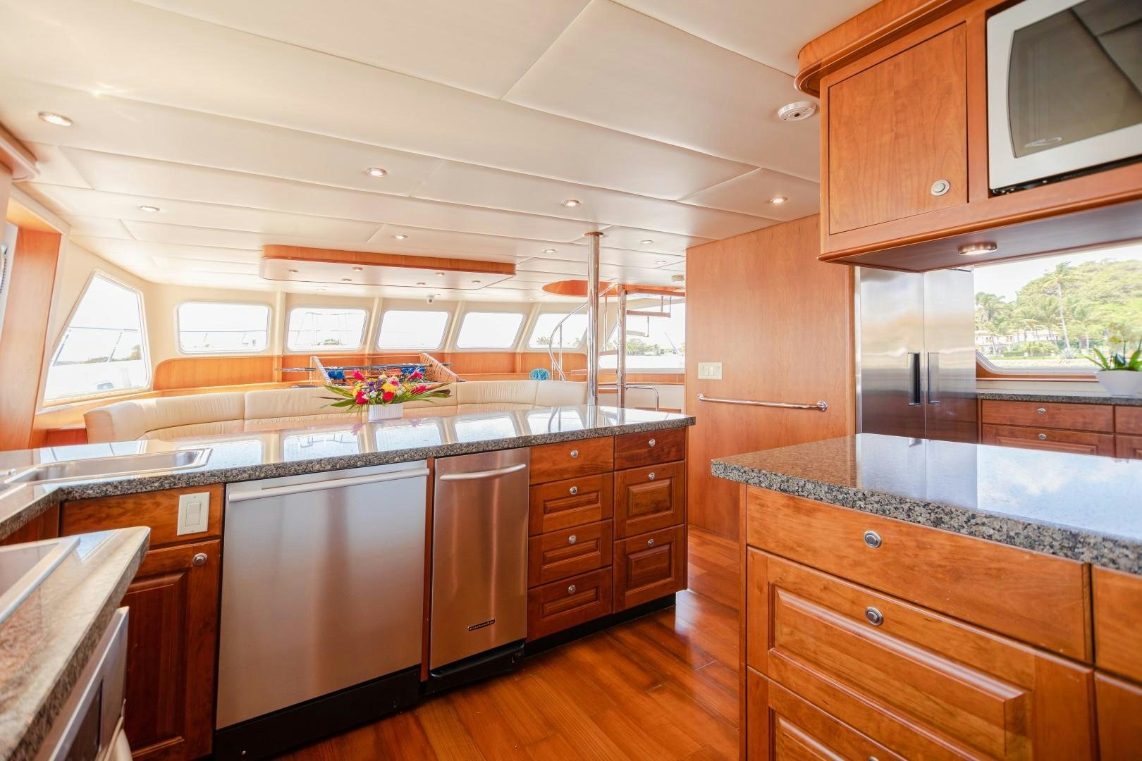 a kitchen with wooden cabinets aboard NO BOUNDARIES Yacht for Sale