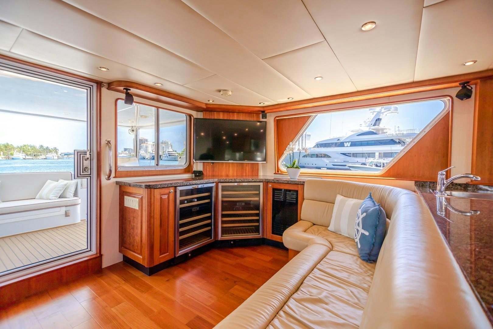 a bedroom with a bed and a large window aboard NO BOUNDARIES Yacht for Sale