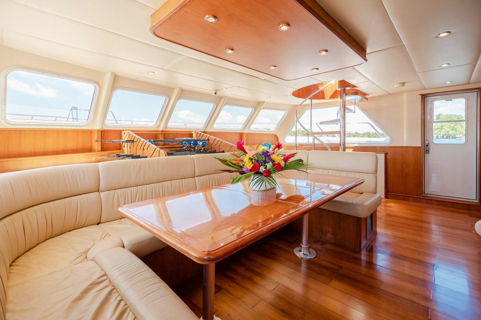 a living room with a table and chairs aboard NO BOUNDARIES Yacht for Sale