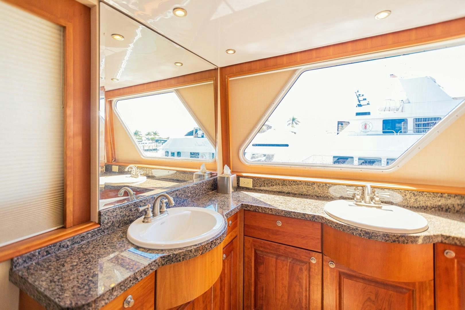 a bathroom with a large mirror aboard NO BOUNDARIES Yacht for Sale