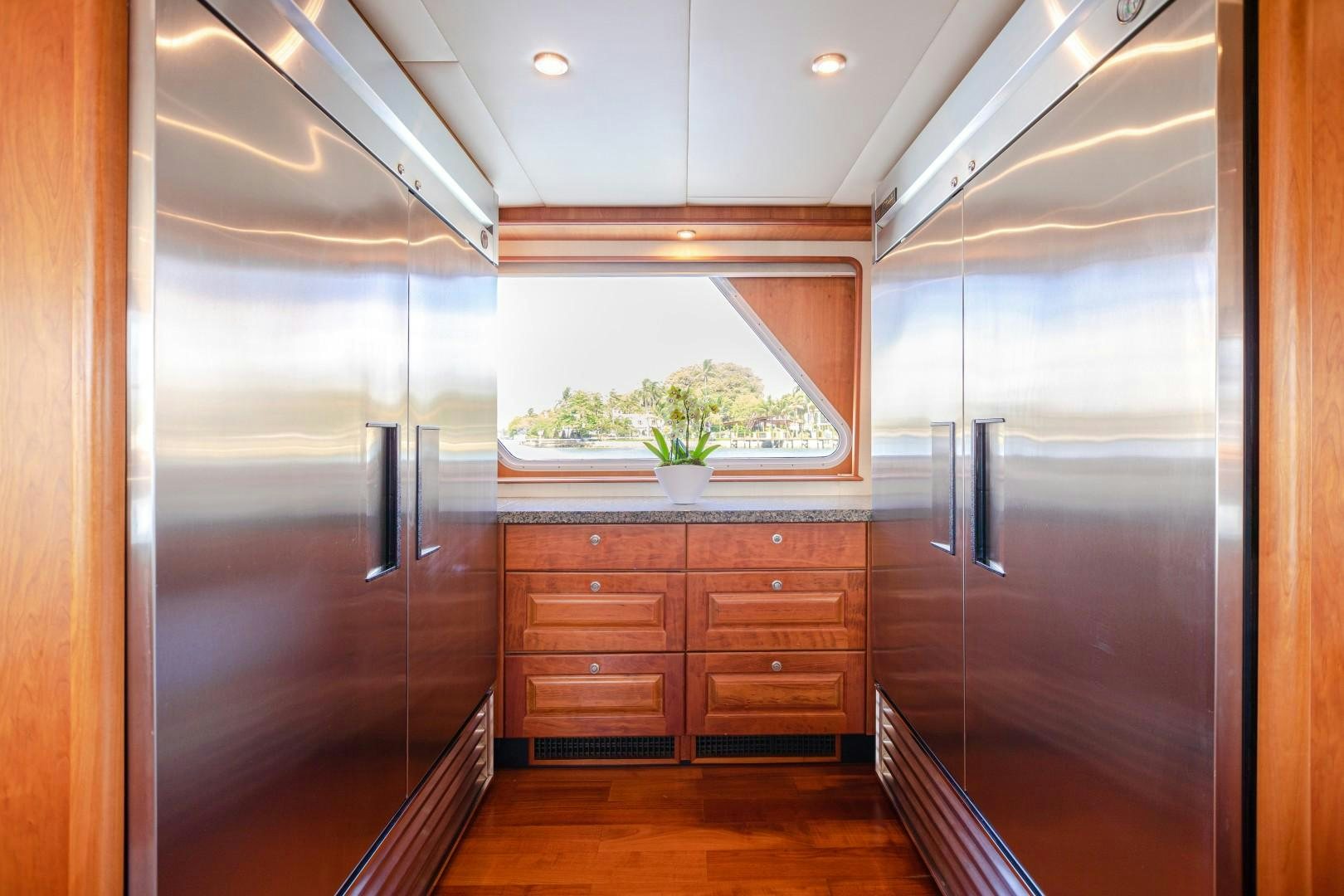a room with a large refrigerator aboard NO BOUNDARIES Yacht for Sale
