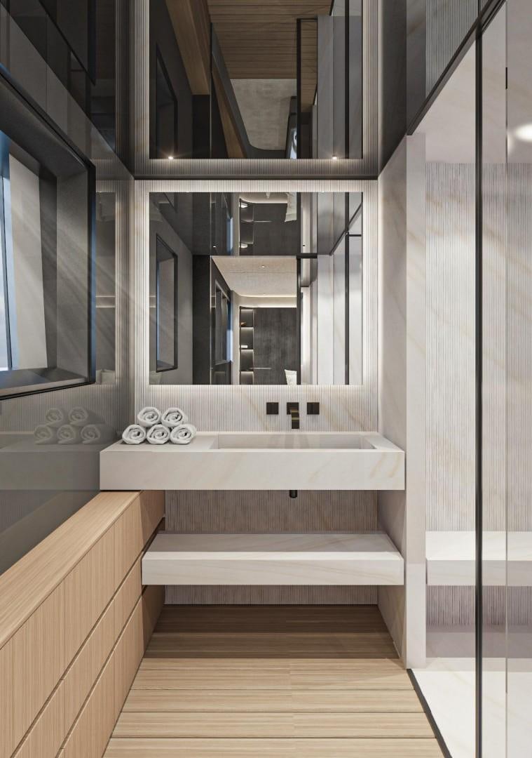 a bathroom with a tub aboard EXTRA TIME Yacht for Sale