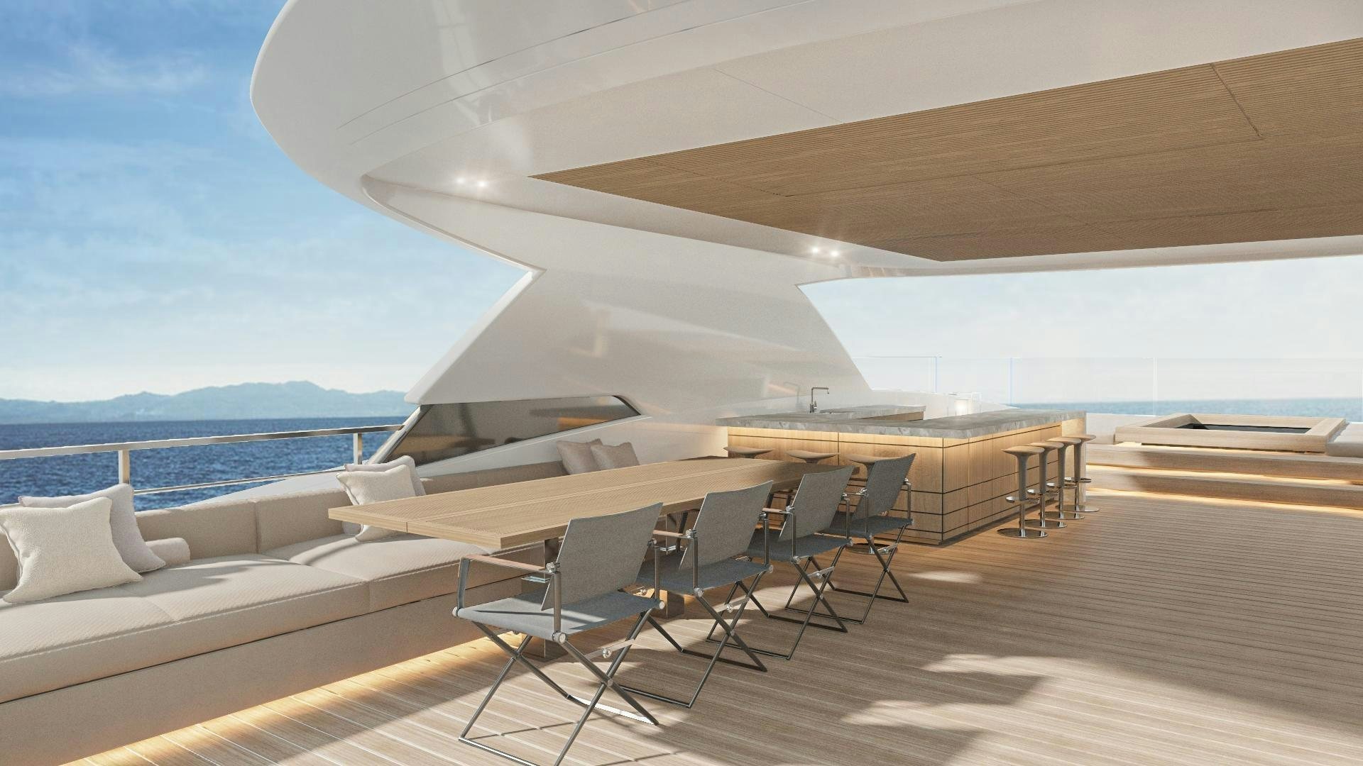 a room with a deck and chairs aboard EXTRA TIME Yacht for Sale