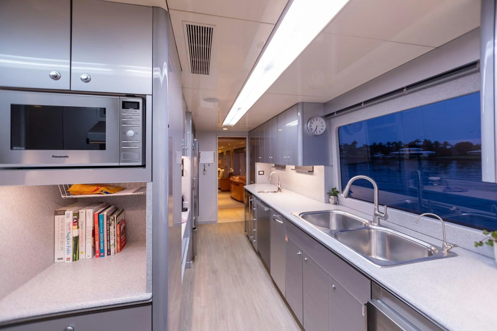 a kitchen with a large window aboard PROBABILTY Yacht for Sale