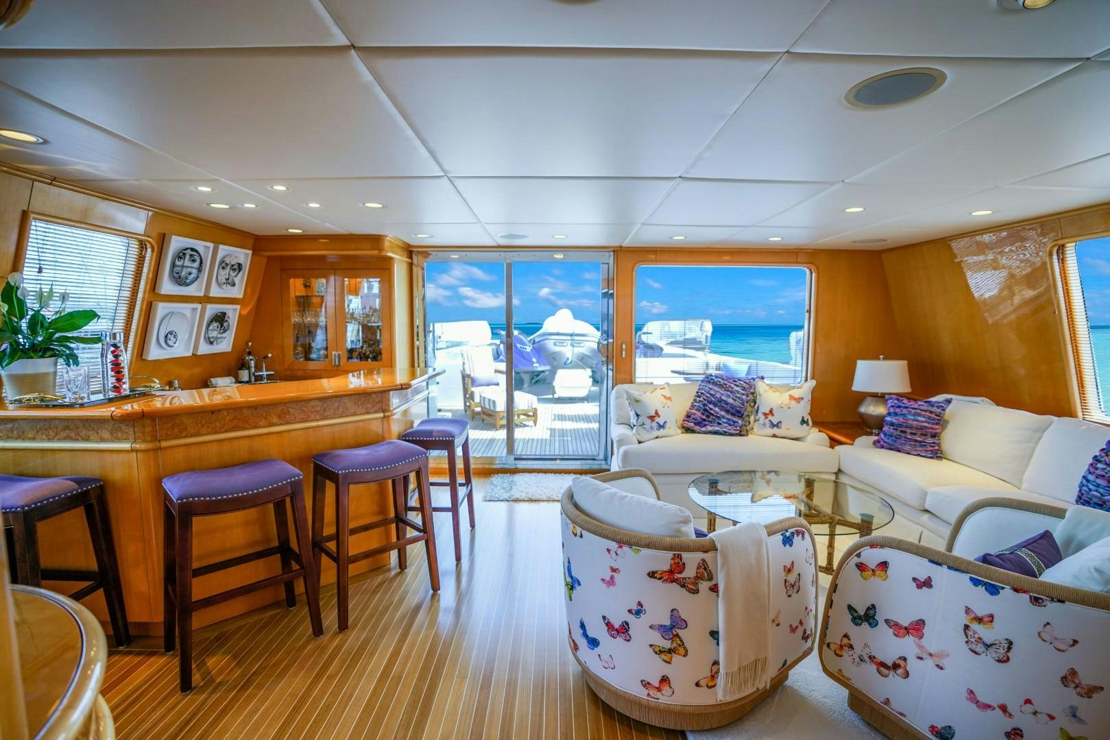 a living room with a table and chairs aboard PROBABILTY Yacht for Sale