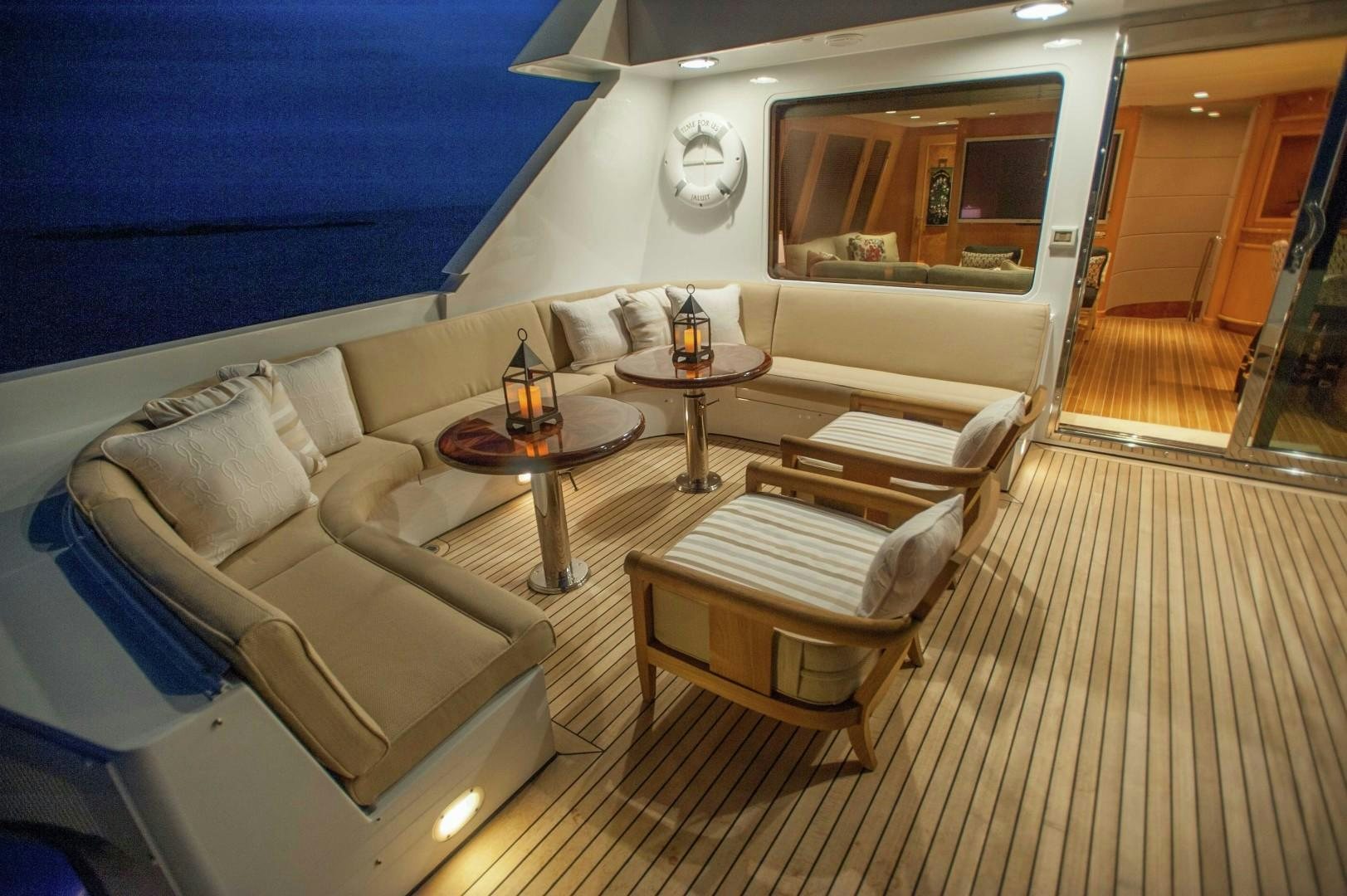a living room with a couch and a table aboard PROBABILTY Yacht for Sale