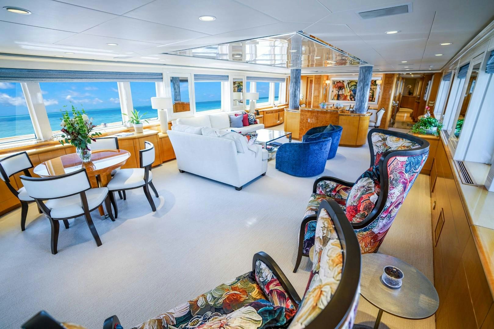 a living room with a large window aboard PROBABILTY Yacht for Sale