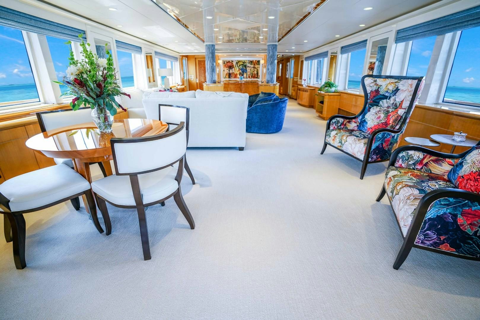 a room with chairs and a table aboard PROBABILTY Yacht for Sale