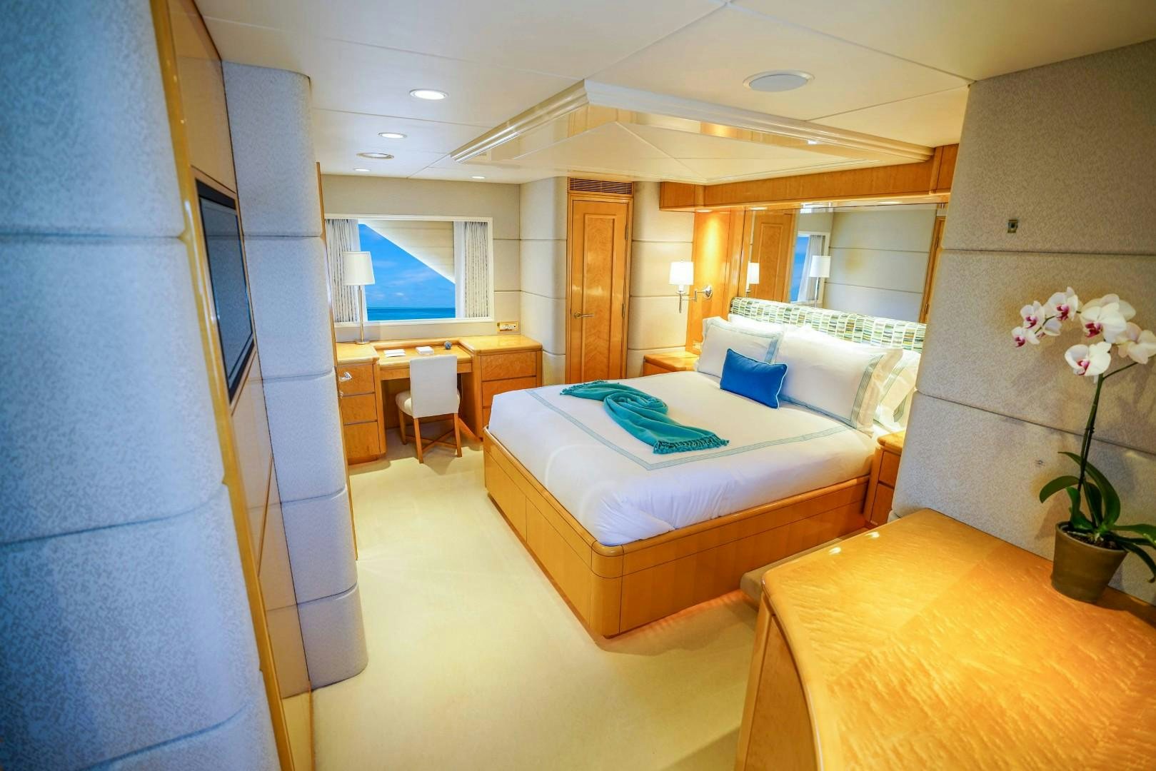 a room with a bed and a table aboard PROBABILTY Yacht for Sale