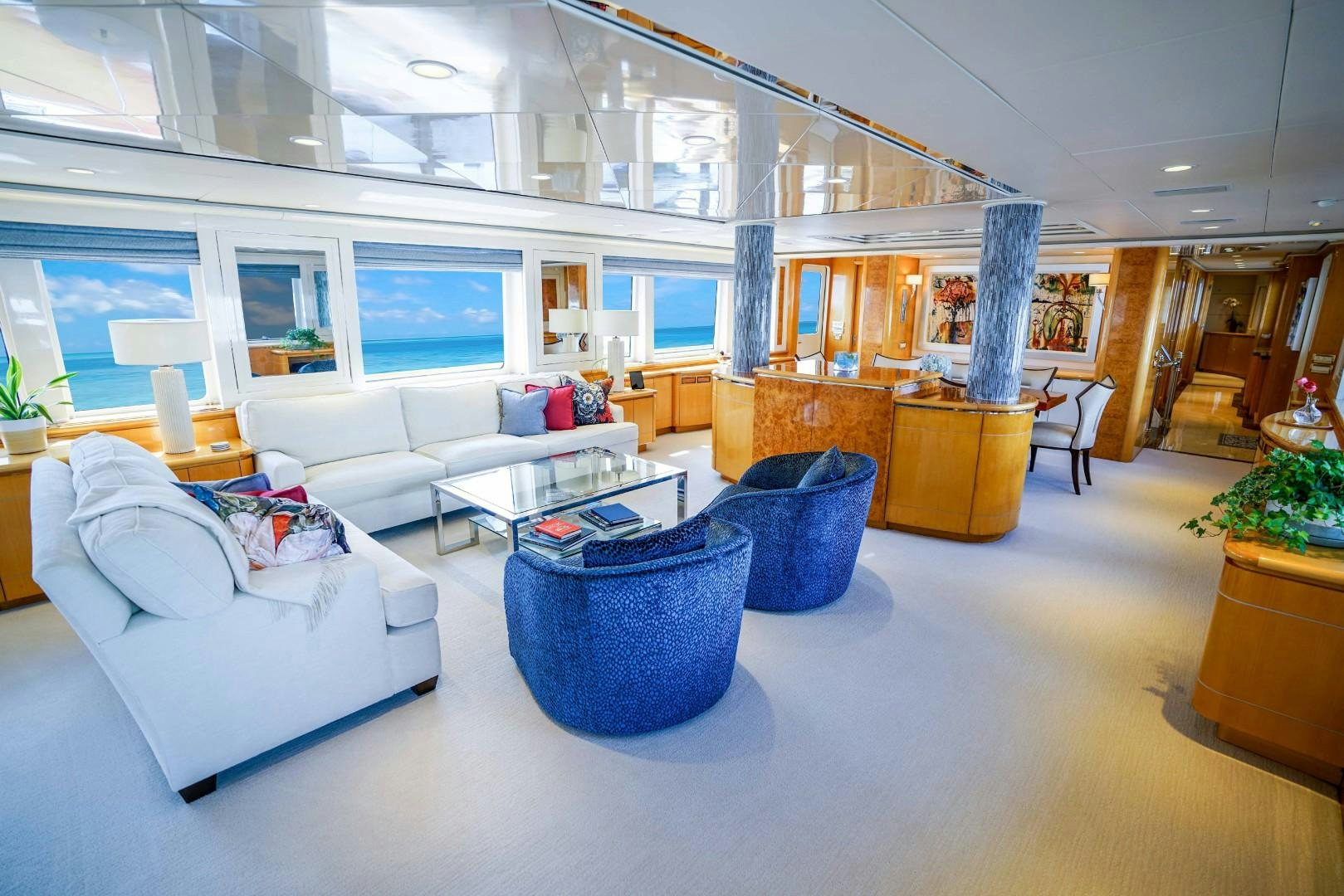 a living room with a white couch and a table aboard PROBABILTY Yacht for Sale