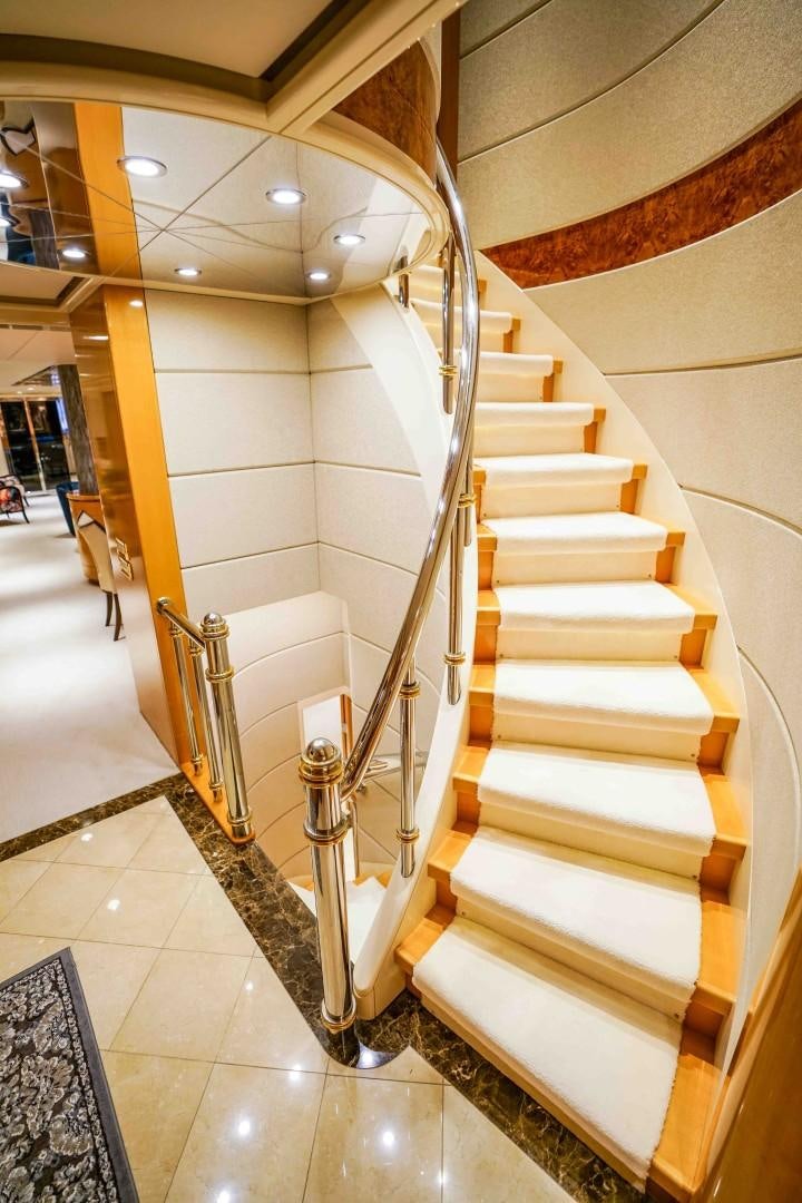 a staircase with white walls aboard PROBABILTY Yacht for Sale