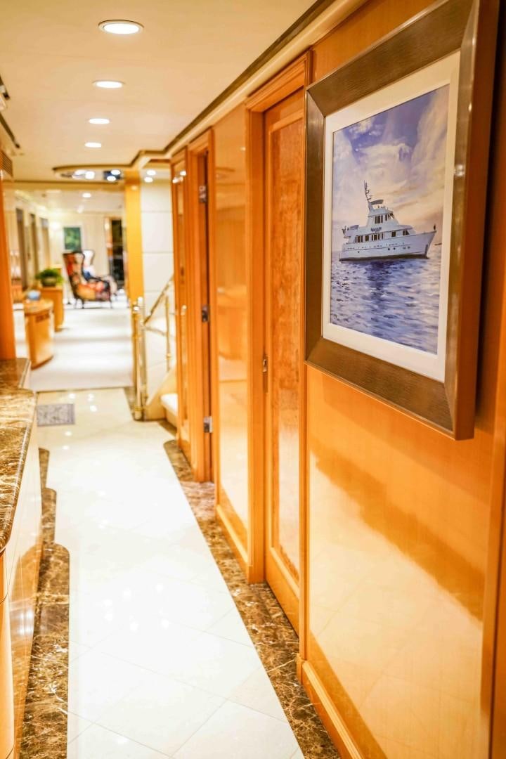 a hallway with a poster on the wall aboard PROBABILTY Yacht for Sale