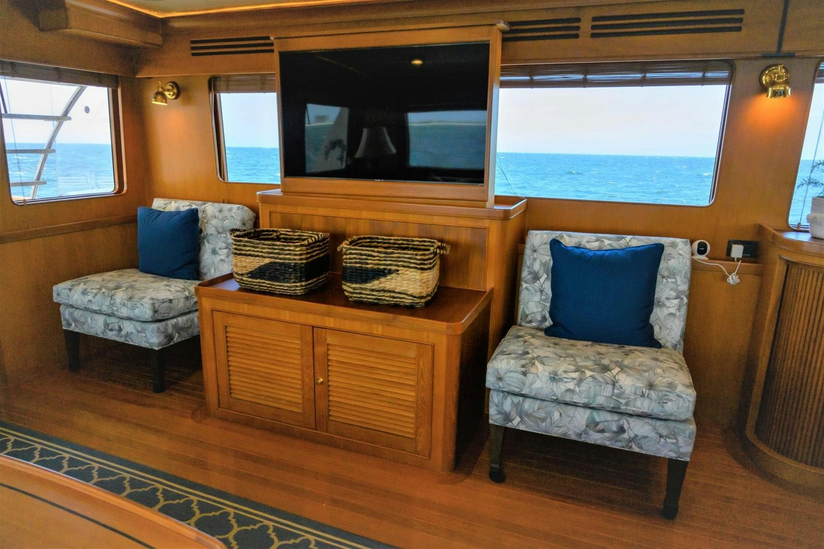 a living room with a couch and a television aboard VK Yacht for Sale