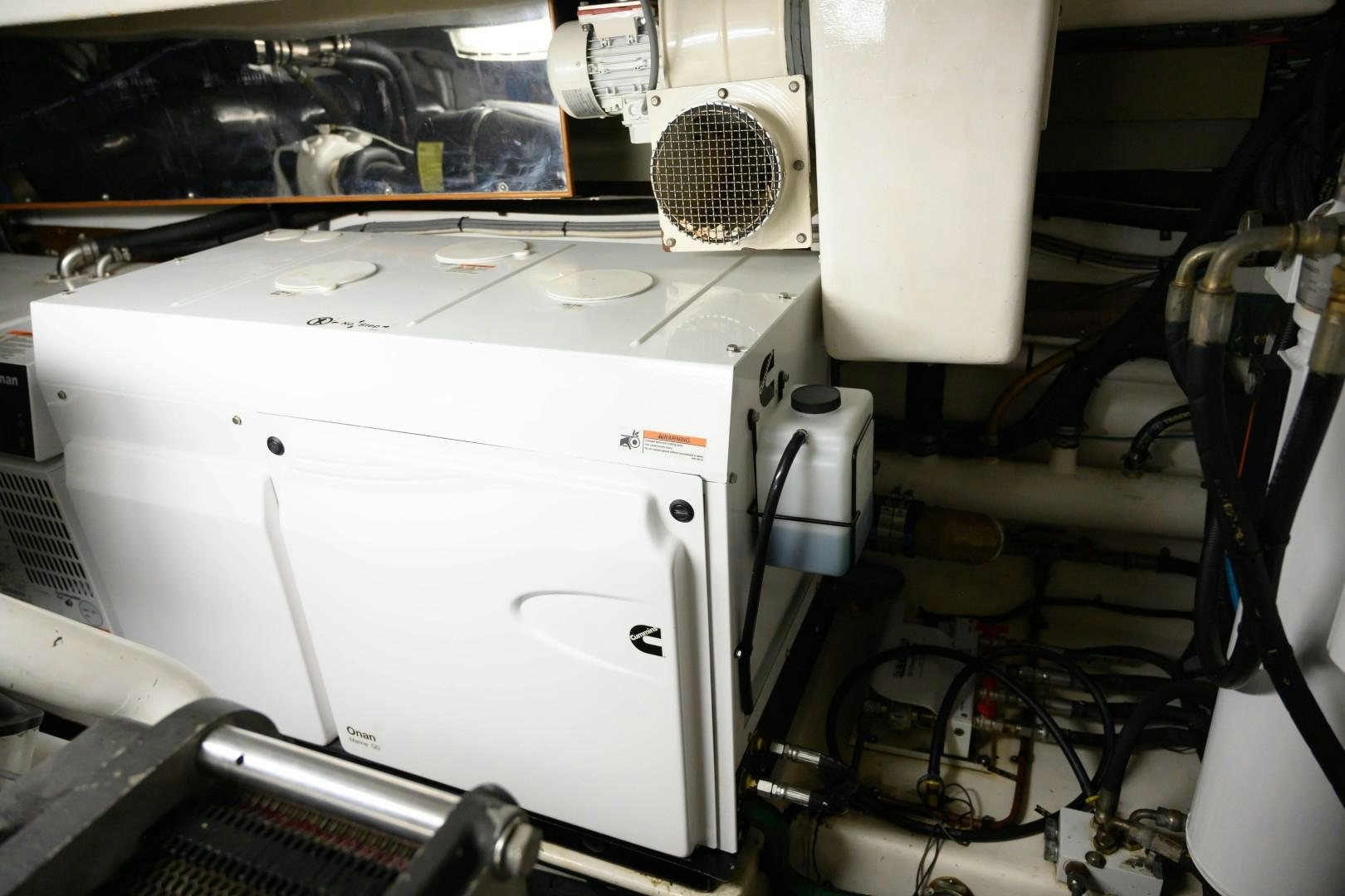 a white machine with a metal frame aboard VK Yacht for Sale