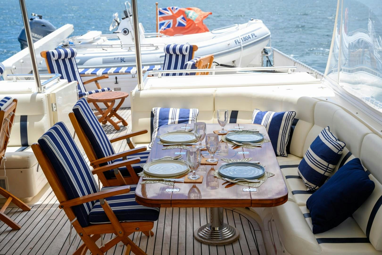a table set for a dinner on a boat aboard VK Yacht for Sale