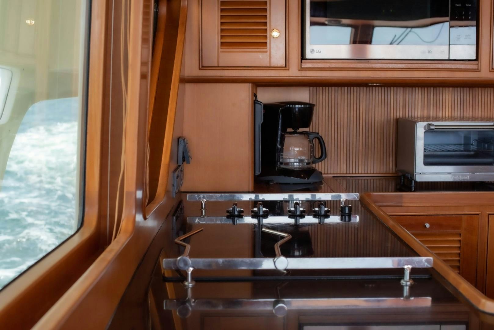 a coffee maker on a counter aboard VK Yacht for Sale
