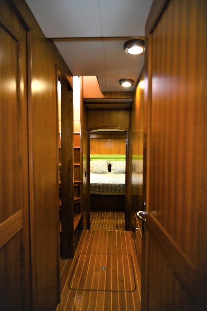 a bathroom with a wood door aboard VK Yacht for Sale
