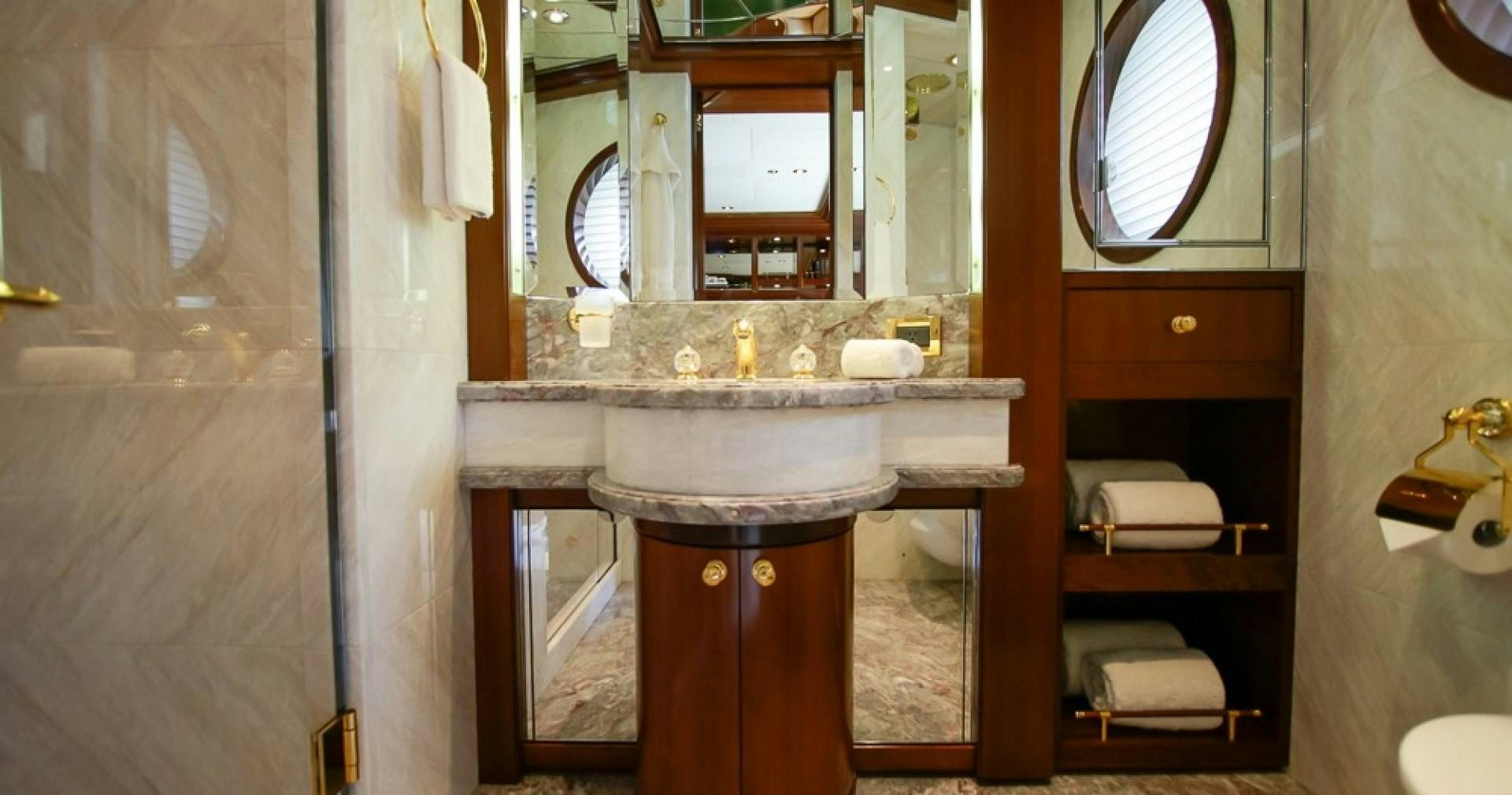 a bathroom with a sink and a mirror aboard BLUE MOON Yacht for Sale