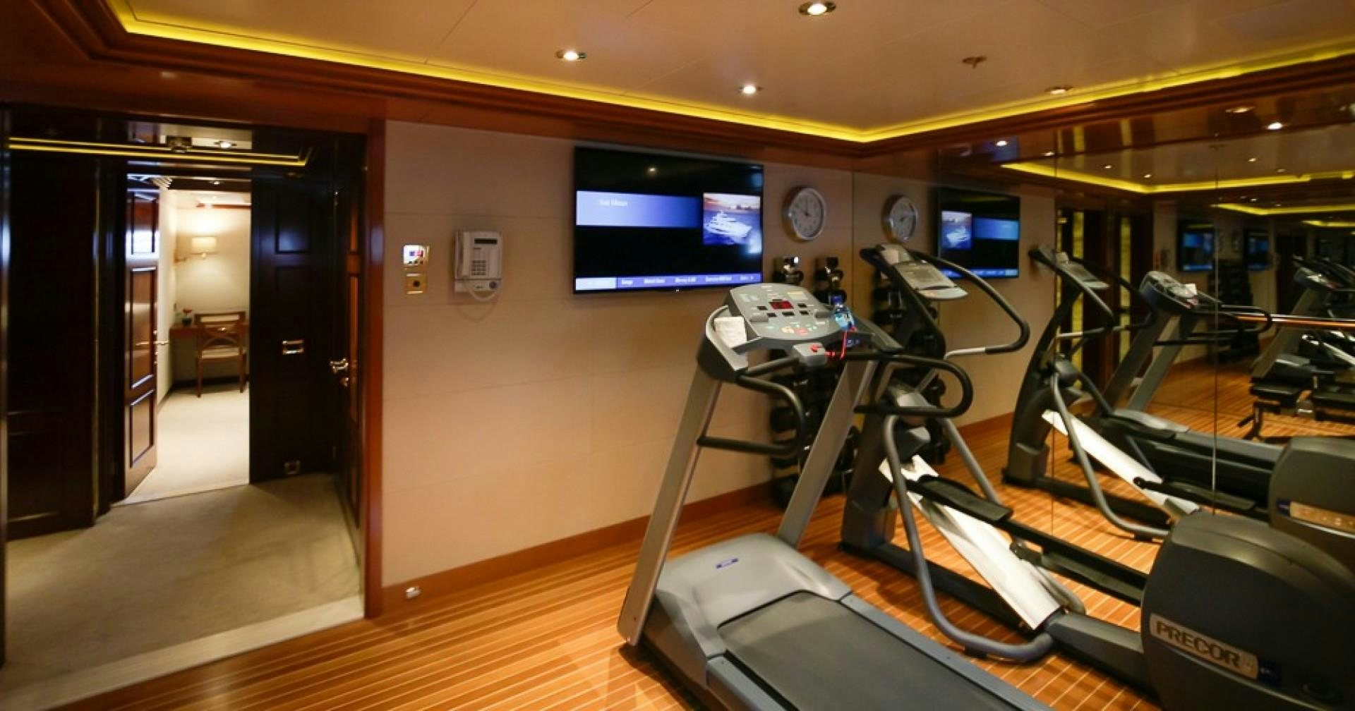 a gym with exercise equipment aboard BLUE MOON Yacht for Sale